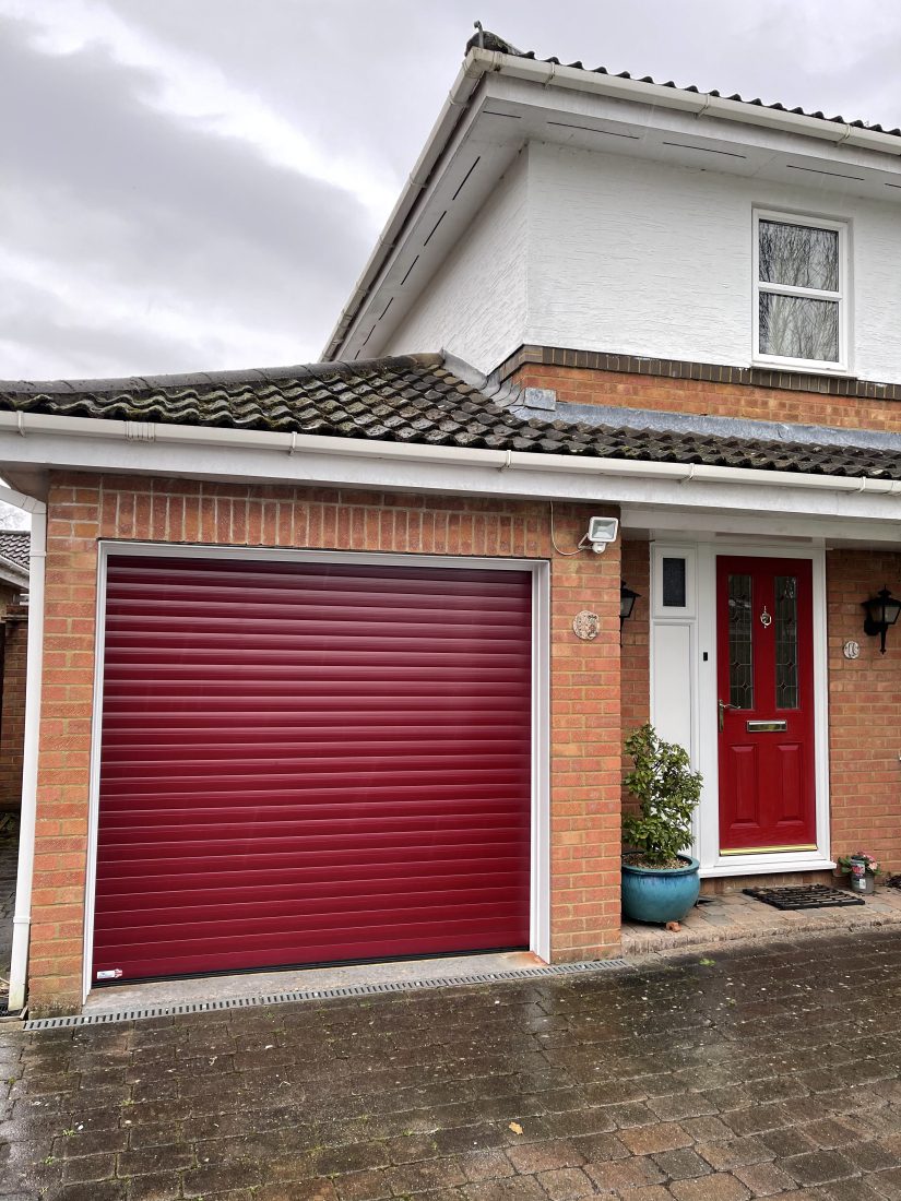 Matching front and roller garage door in ruby red.