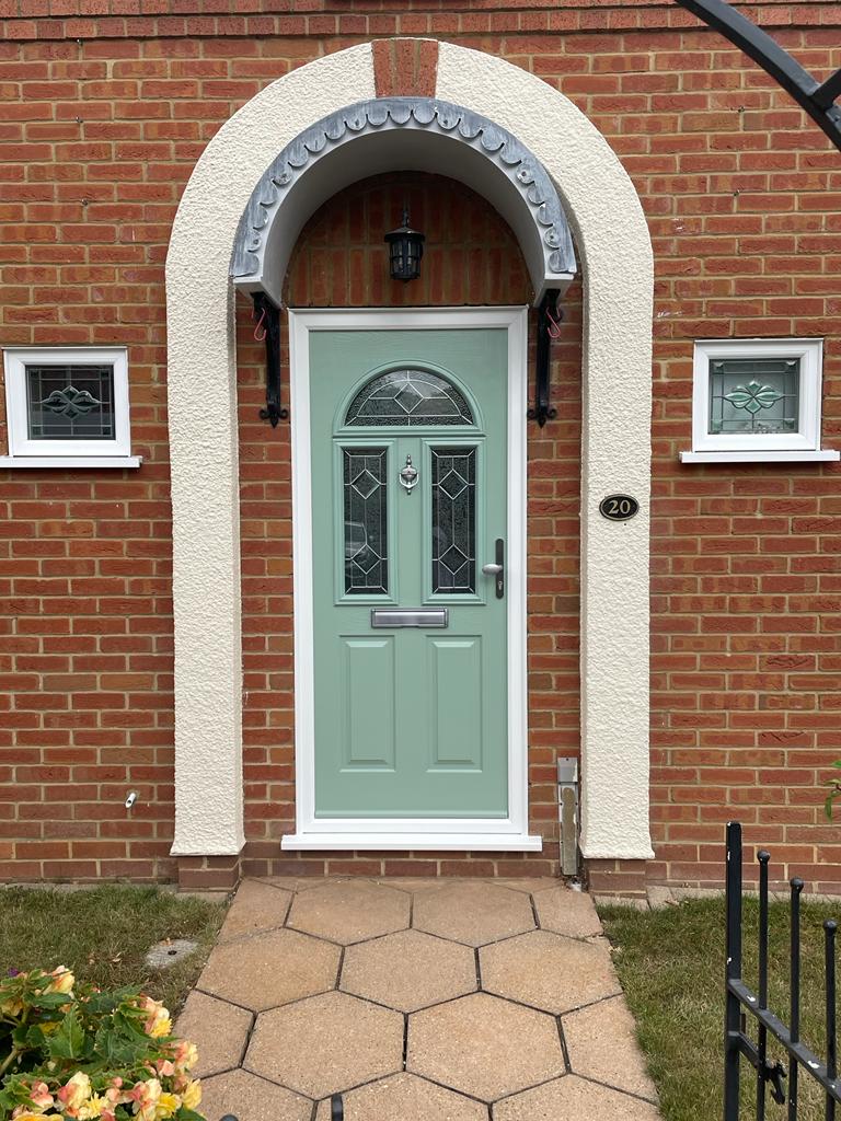 Composite front door in Chartwell green.