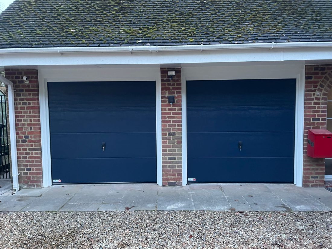 Double sectional garage doors in standard blue.
