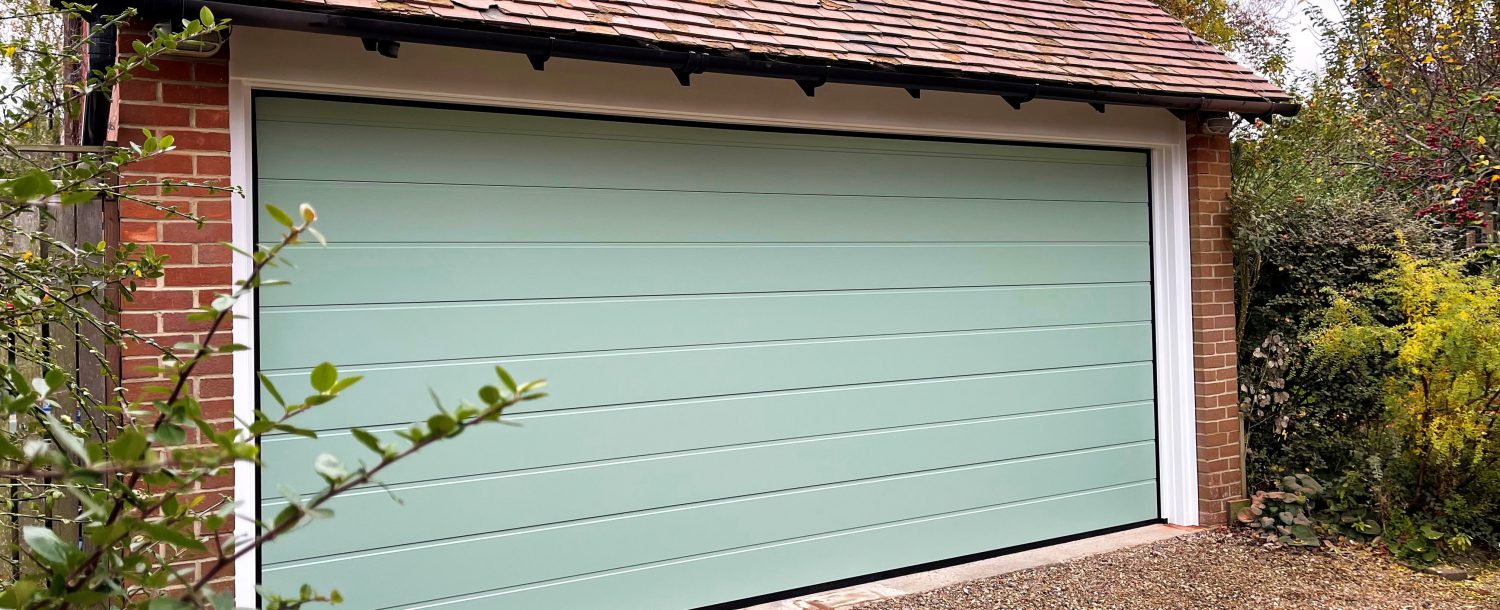 Sectional garage door in Chartwell green